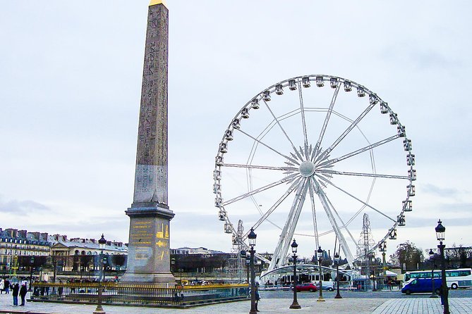1 day in Paris with Friendly Local Guide - Stop 5: Champs-Élysées and Arc de Triomphe as a moving photo stop