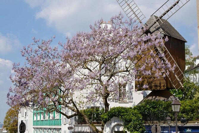 Clos Montmartre 'Paris in your Glass' Wine Tasting - The charming in-between stops: Passe-Muraille, Moulin de la Galette, and Suzanne-Buisson
