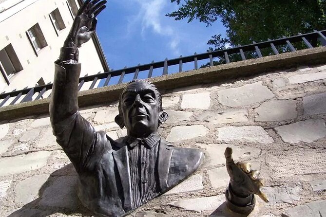 ESSENTIAL MONTMARTRE Walking Tour: the essential highlights+MORE! - Moulin Rouge and Le Passe-Muraille, pop culture meets odd art