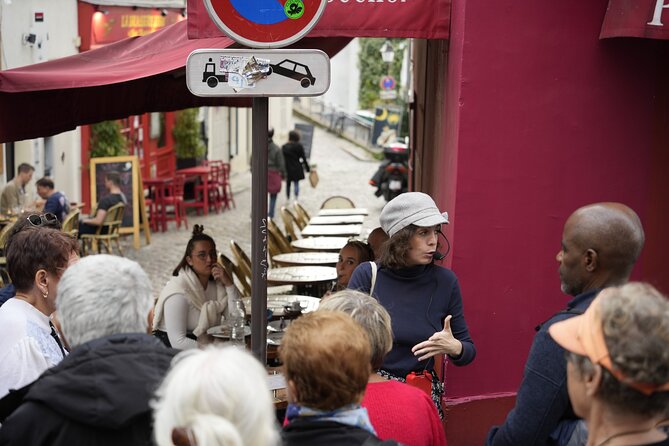 Guided tour of Montmartre in songs with a professional - Rue des Abbesses, Rue Lepic, and the Moulin de la Galette connection