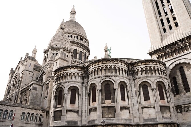 Hidden Montmartre: Paris' Secret Streets Walking Tour - Le Moulin de la Galette, Expensive Houses, and a Secret Passage