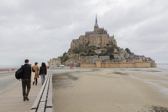 Mont Saint Michel Day Trip with Abbey Entrance from Paris - Fortifications and the Tide Show: Watching the Bay Change