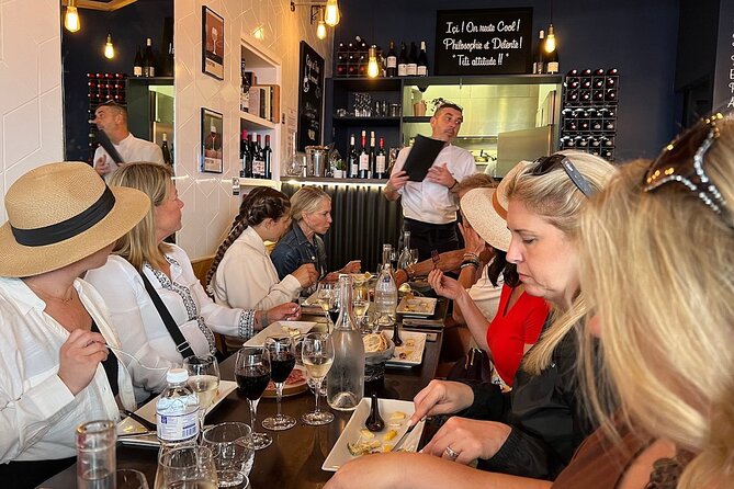 Montmartre Hill French Gourmet Food and Wine Tasting Walking Tour - Le Mur des Je taime and Place du Tertre: art history you can snack beside