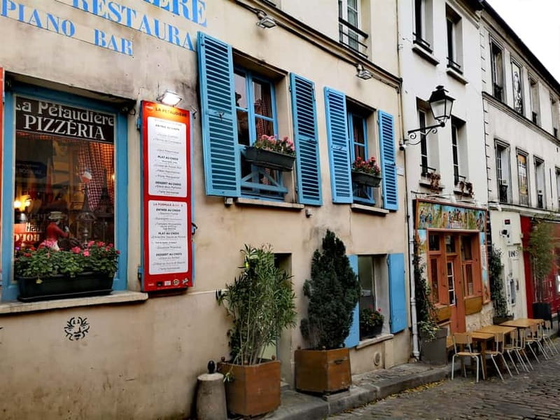 Montmartre : private family tour - Passe-Muraille, Le Consulat, and La Bonne Franquette: the quick myth stops