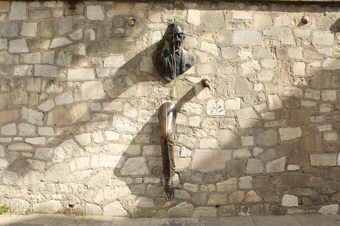 Montmartre Private Walking Tour - Stop 3: Le Passe-Muraille, the statue that captures Montmartre attitude