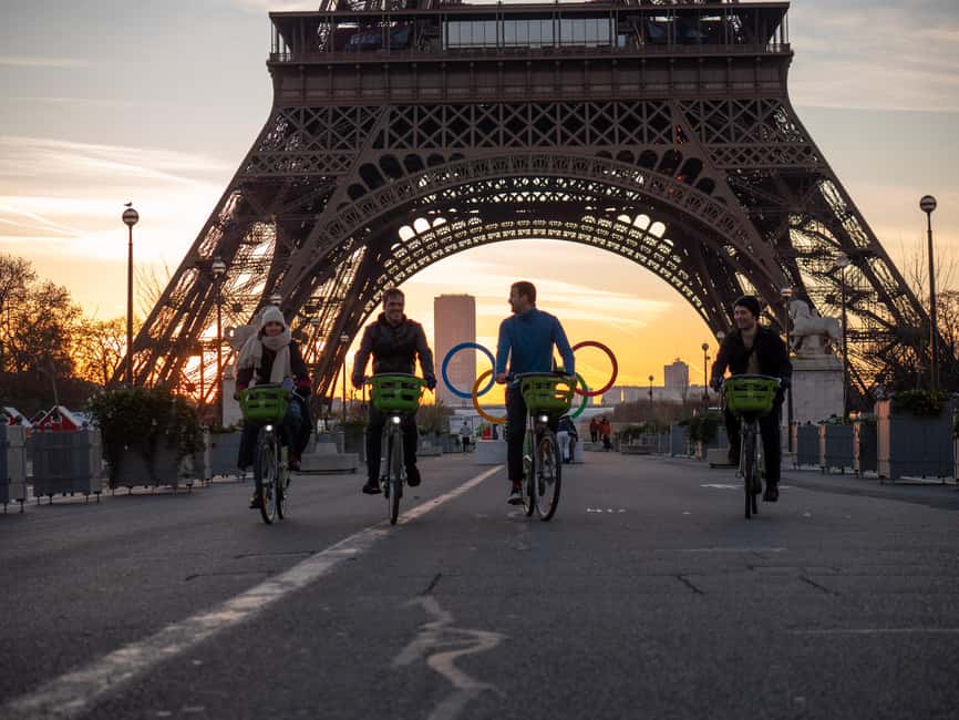 Paris Before the Crowds: Sunrise Bike Tour with Breakfast - The Louvre area at first light, with calmer pyramid photos
