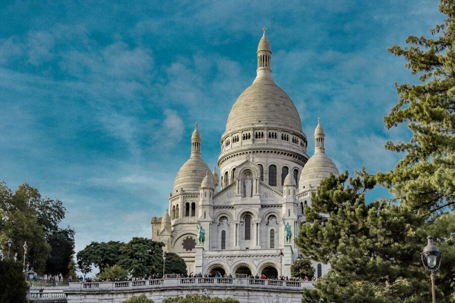 Paris: Charms of Montmartre Guided Walking Tour - The climb up: Amélie spots and Van Gogh corners
