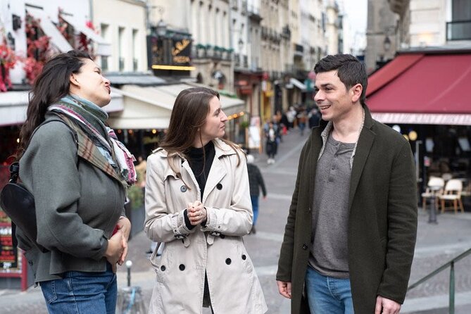 Paris Christmas Tour with a Local Guide: Custom & Private - The Notre Dame market area: festive stalls and a warm drink