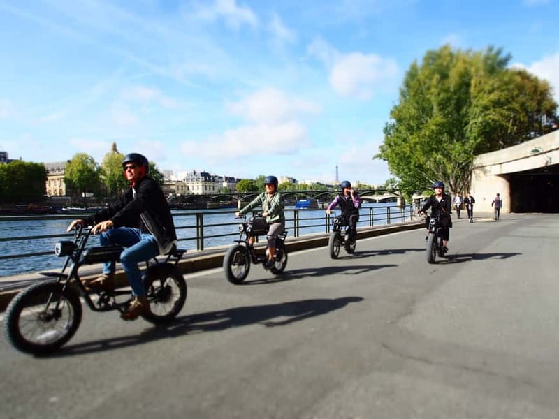 Paris: City Highlights Private Electric Bike Tour with video - Place des Vosges and Notre-Dame area, where the streets feel made for slow riding