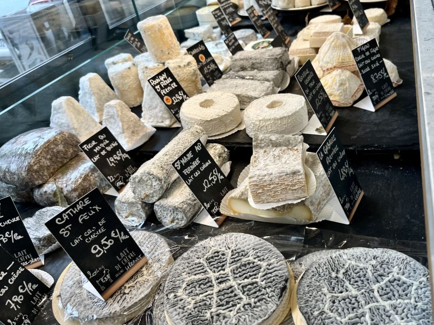 Paris: Guided Champagne & Food Tour in St-Germain-des-Pres - Five shops, six bites: how the tastings are built for pairing