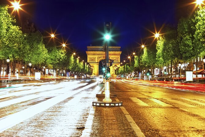 Paris Illuminations Tour with Moulin Rouge Show and Cruise Option - The Eiffel Tower area stop before the big cabaret jump
