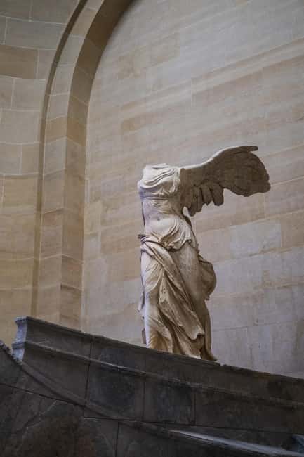 Paris: Louvre Masterpieces Tour with Pre-Reserved Tickets - How the guide builds meaning across major Louvre eras