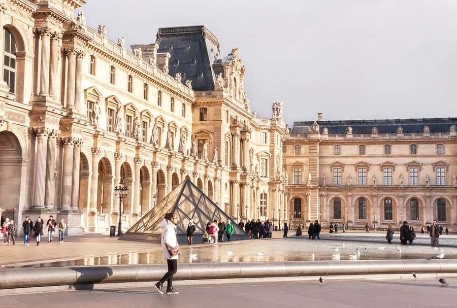 Paris: Louvre Museum Entry Ticket and Garden Walking Tour - Louvre Pyramid and the Arc de Triomphe du Carrousel stop you for photos, then meaning