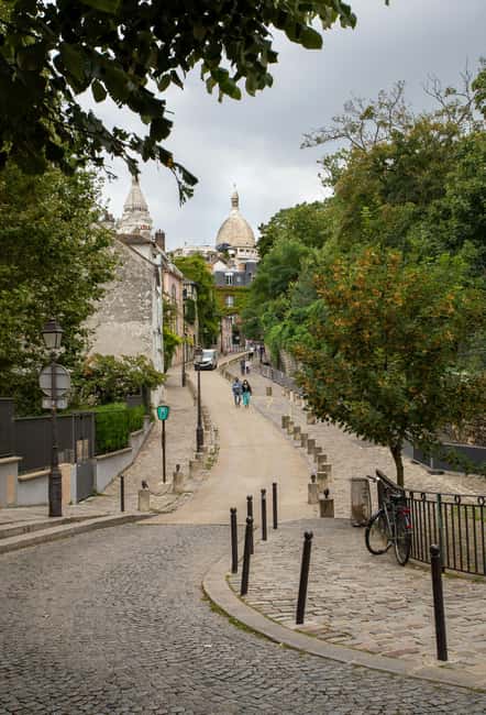 Paris: Montmartre hidden gems walking Tour with Local Guide - How Montmartre changed from mills to artists and revolutionaries