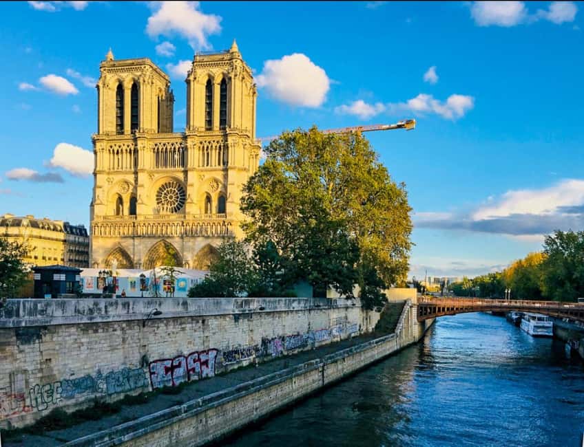 Paris: Notre Dame Exteriors and Ile de la Cité Walking Tour - Place Dauphine: A Peaceful Square Stop for Breathing Room