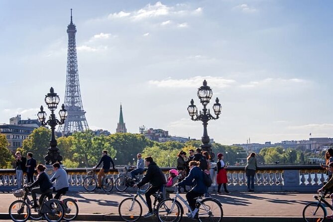 Paris Small Group Guided Bike Tour of Must-See Sights - Eiffel Tower stop: a quick view plus the story behind the Iron Lady