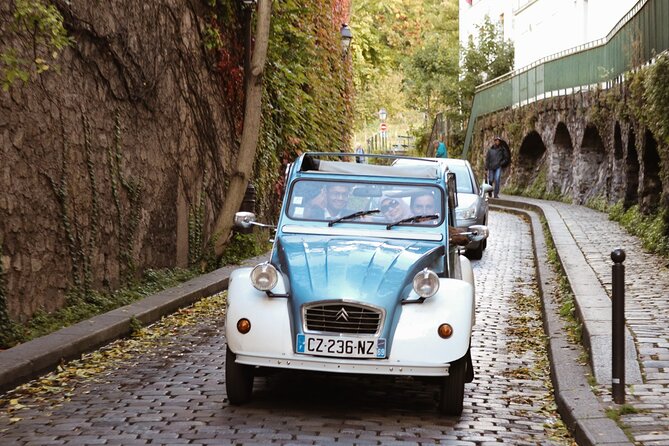 Vintage 2CV Adventure: 1 Hour 30 min Paris Secrets Tour - Stop 1: Eiffel Tower from outside, a quick but perfect photo break
