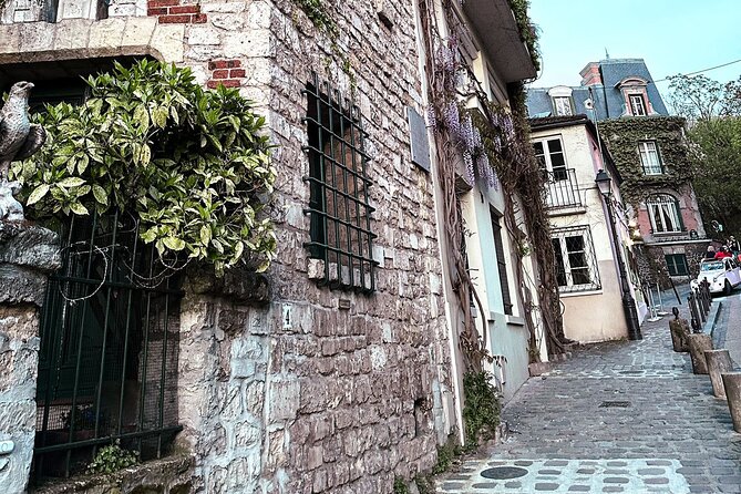 Walking Tour in Montmartre with a guide - Stop 2: Eglise de St Jean Montmartre, red brick and art nouveau light